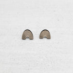 Rainbow earring made out of wood. Purchases support women who have aged out of foster care.