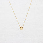 Minimalist, gold-filled necklace stamped with a vine